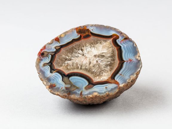 Chalcedony with green soil on the shell