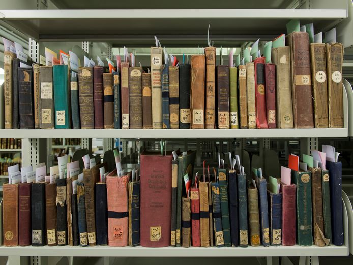 Fabric heat- and water-damaged books after restoration