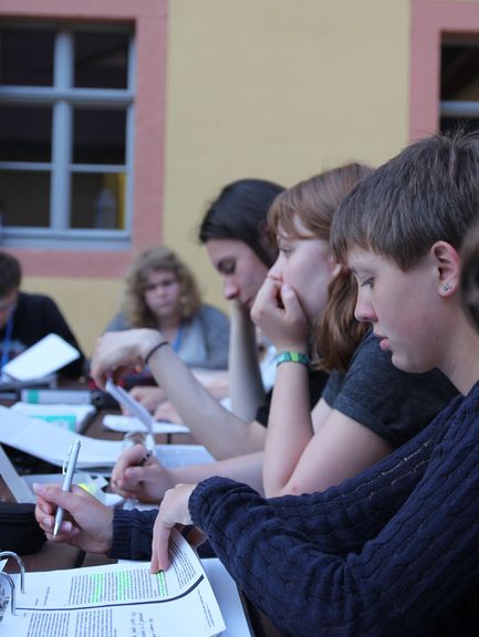A group of young people working with texts
